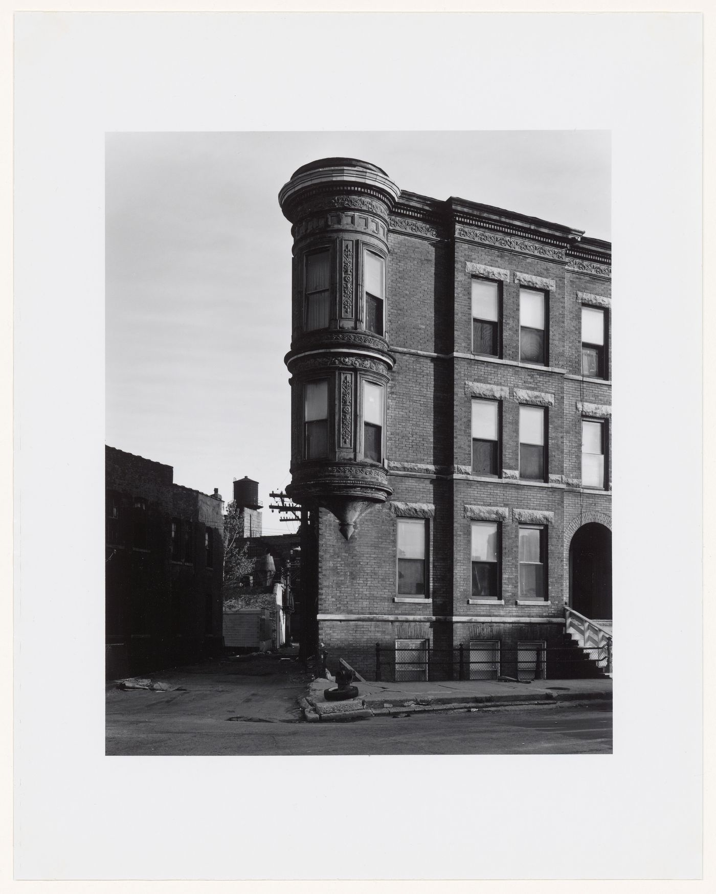 View of an apartment house with a turret showing an alley on the left, Blackhawk Street, Chicago, Illinois, United States