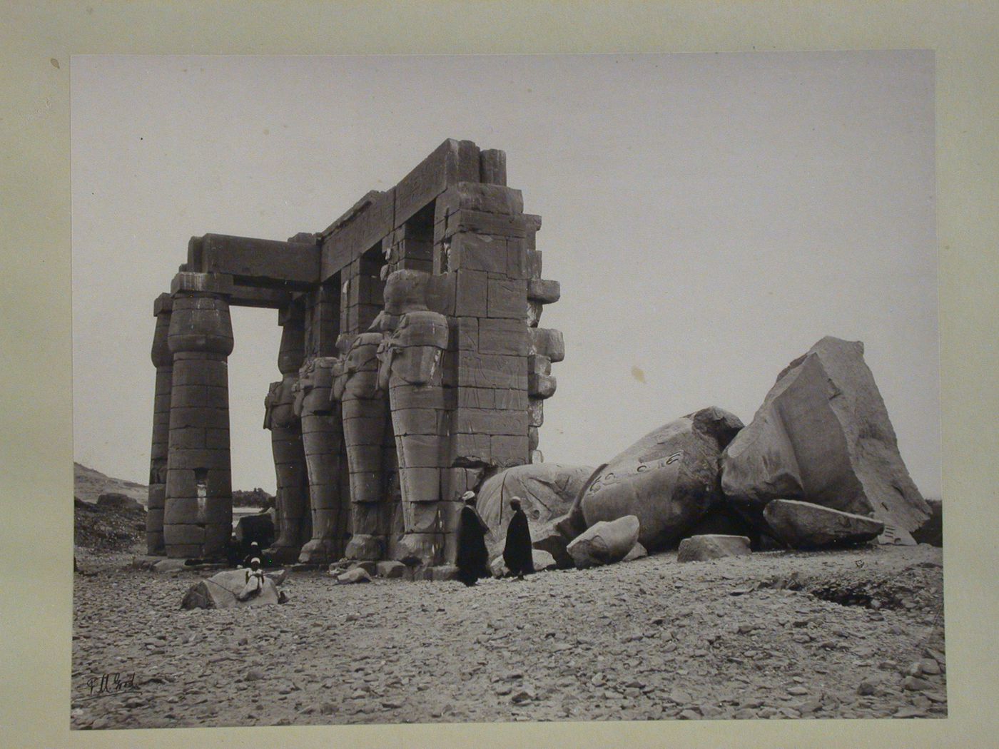 Ramesseum, Second Court, view of Osiris pillars on south front of court, and fallen colossal statue, Ramesses II, Thebes, Egypt