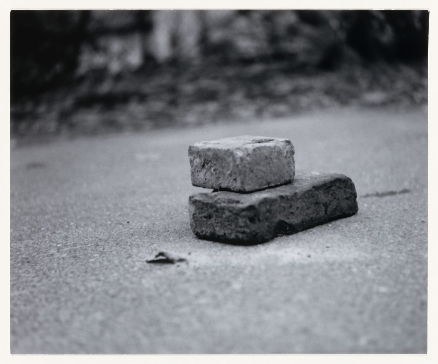 View of two bricks and pavement, Berlin, Germany, from the artist book "The Potsdamer Project"