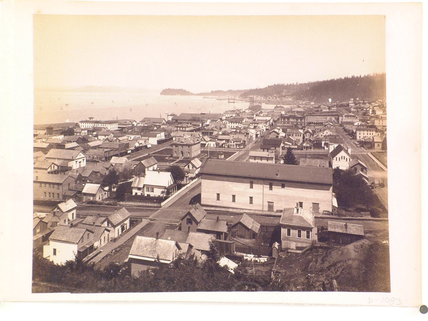 Northwest Coast town, view of town with harbor in background