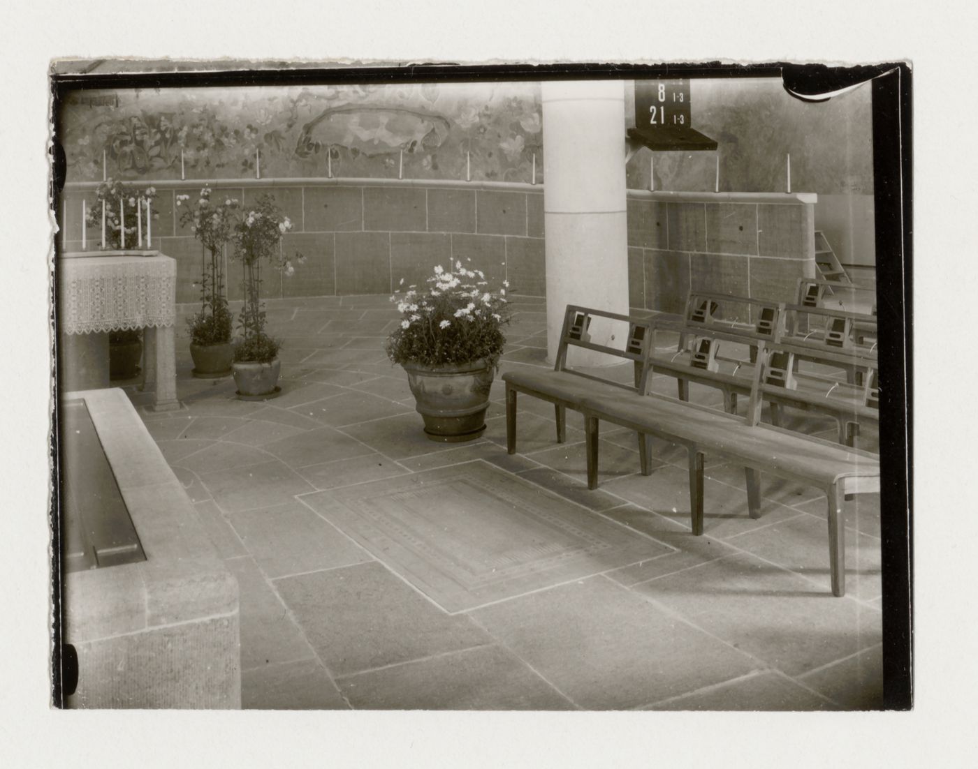 Interior view of the Chapel of the Holy Cross showing the altar, pews and ceramic floor tiles [?], Woodland Crematorium and Cemetery, Stockholm
