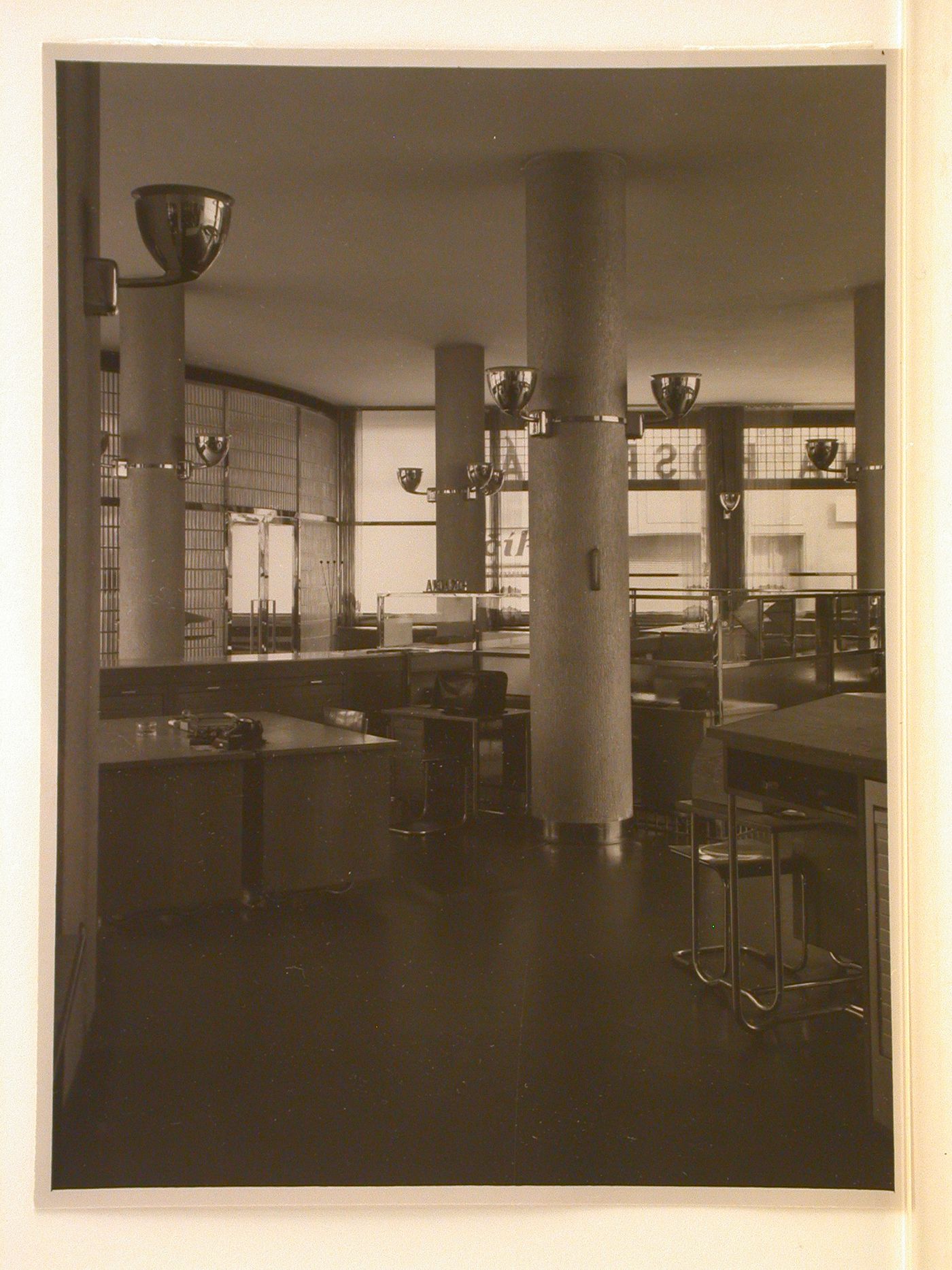 Interior, bank, with freestanding glass partitions curved translucent glass wall, and furniture, Czech Republic