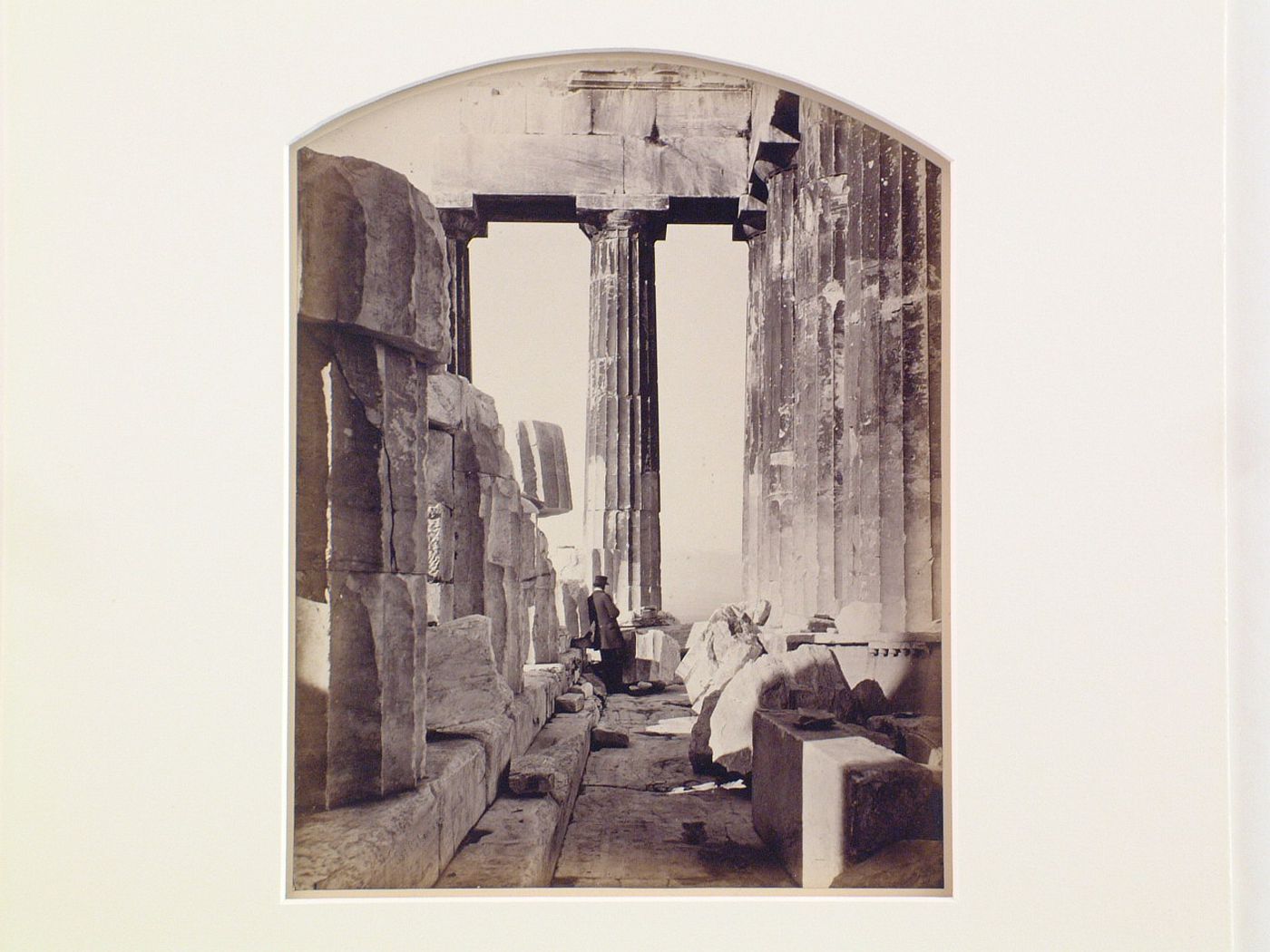 View of East porch of the Parthenon, with person in top hat, possibly William Stillman, standing at the far end, Acropolis, Athens, Greece