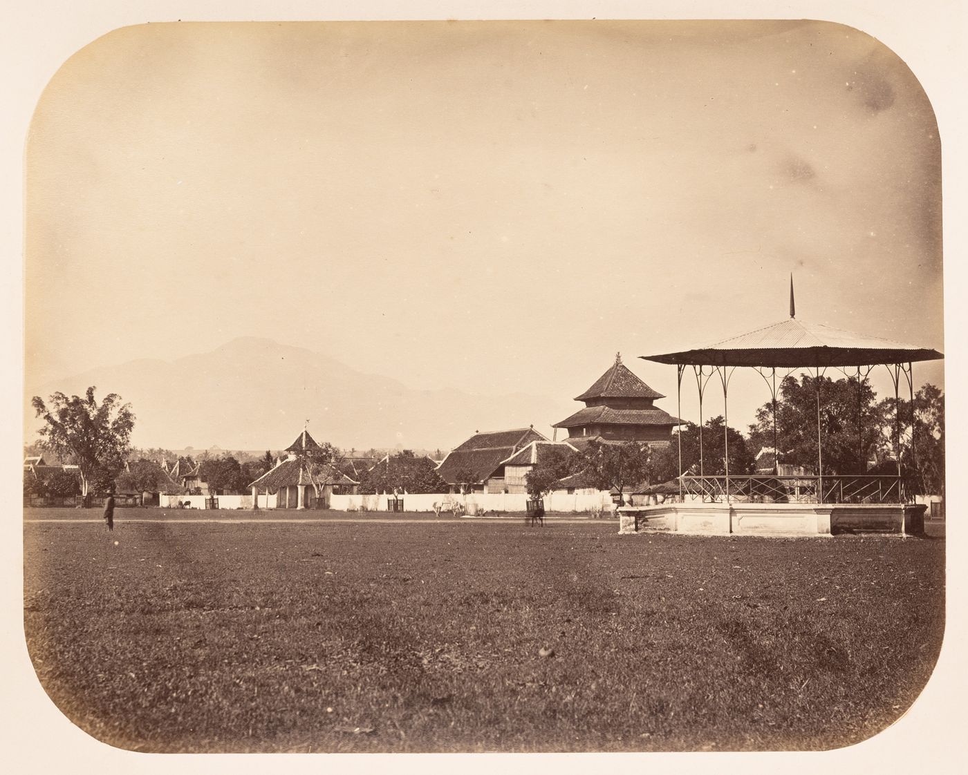 View of a building complex showing a lawn and a garden pavilion, Semarang, Dutch East Indies (now Indonesia)