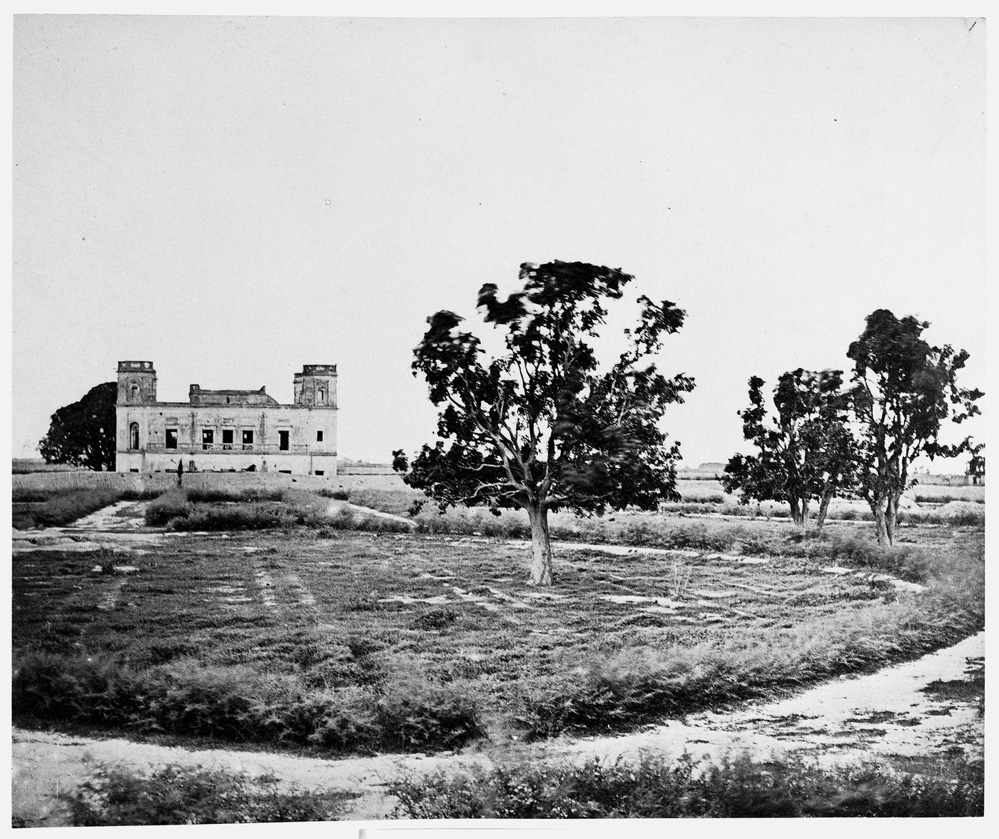 View of the burial site of Major General Sir Henry Havelock showing the ruins of the mansion of the Alam Bagh [World's Garden complex] in the background, near Lucknow, India
