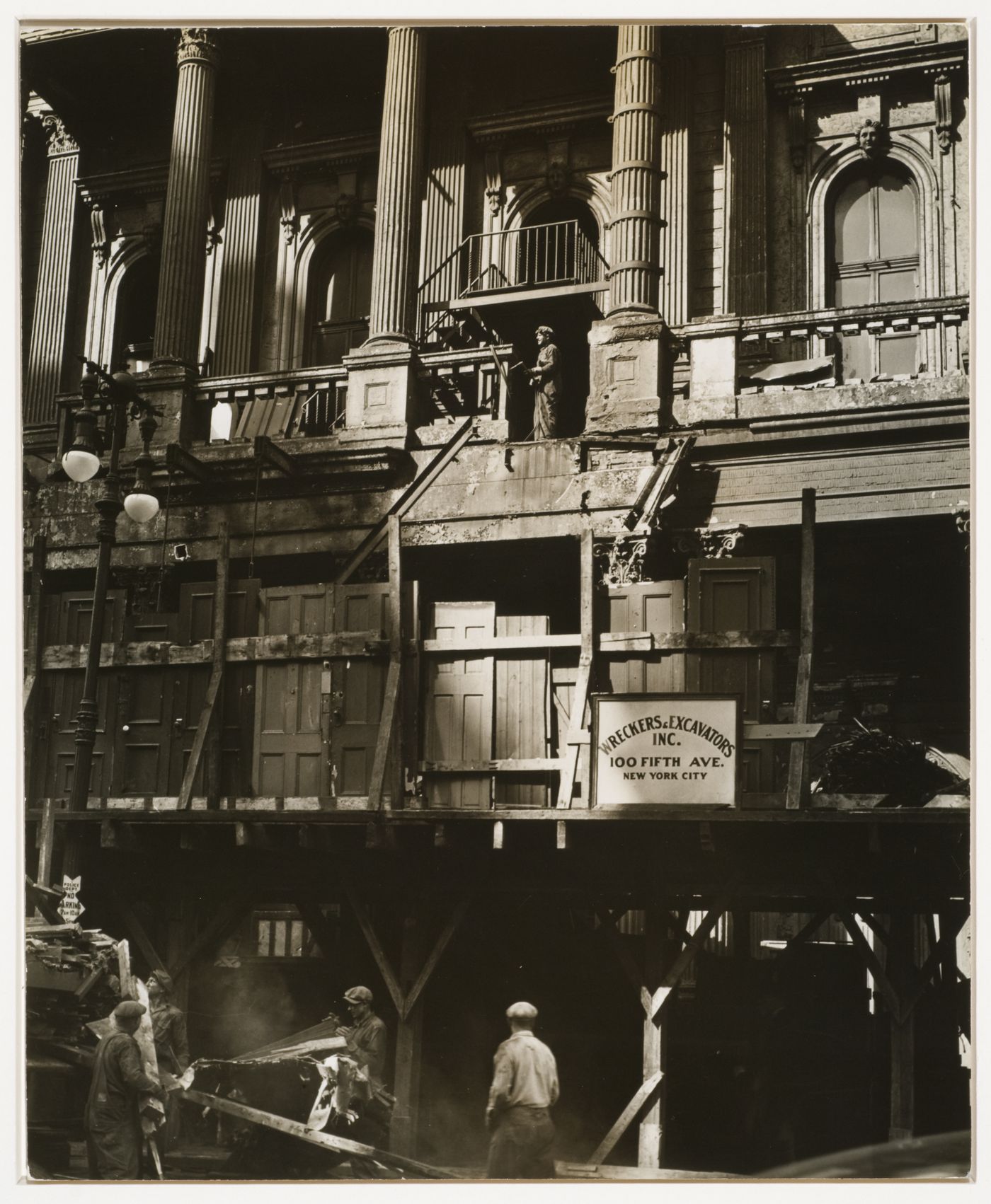 Wrecking crew taking down building, New York City, New York