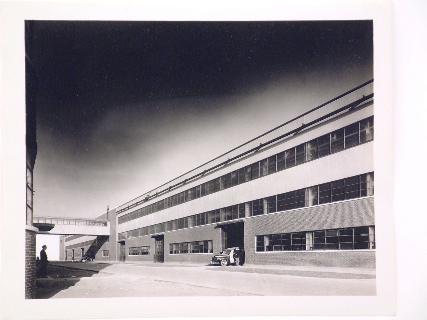 View of the west façade of the Manufacturing Building showing the skywalk to the School, Ford Motor Company Willow Run Bomber Assembly Plant, Willow Run, Michigan