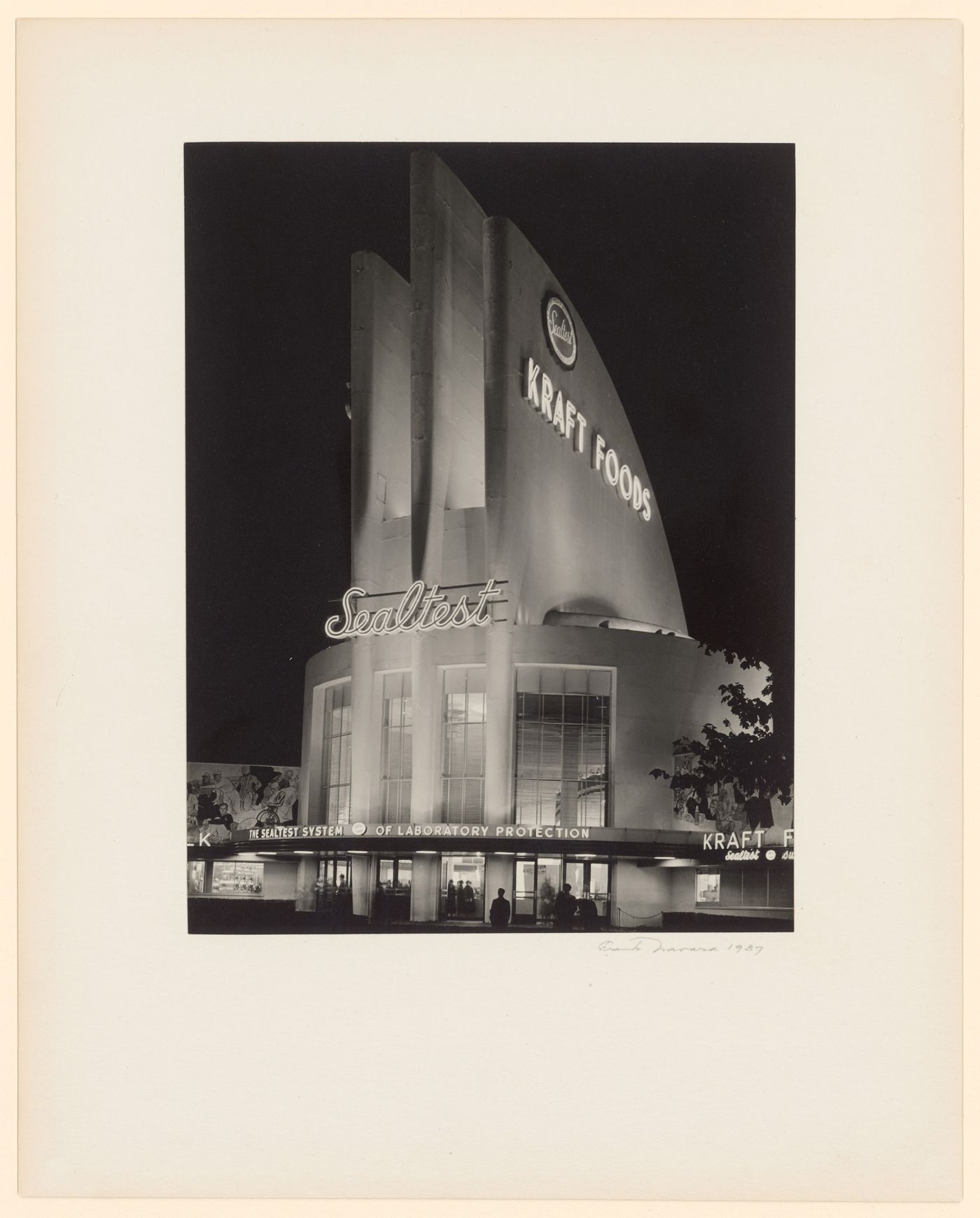 New York World's Fair (1939-1940): Frontal view at night of façade of National Dairy Products Corporation (Sealtest) Building