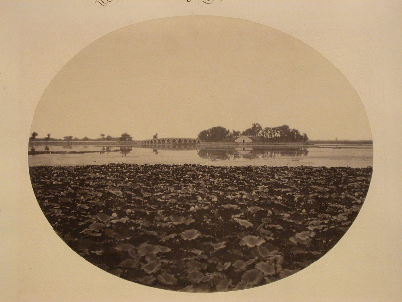 View of the Seventeen-Arch Bridge, the East Causeway, Kuoru Ting [Spacious Pavilion or Pavilion of Expanse], Nanhu Island, and Kunming Lake, the Garden of the Clear Ripples [Qing Yi Yuan] (now the Summer Palace or Yihe Yuan), Peking (now Beijing), China