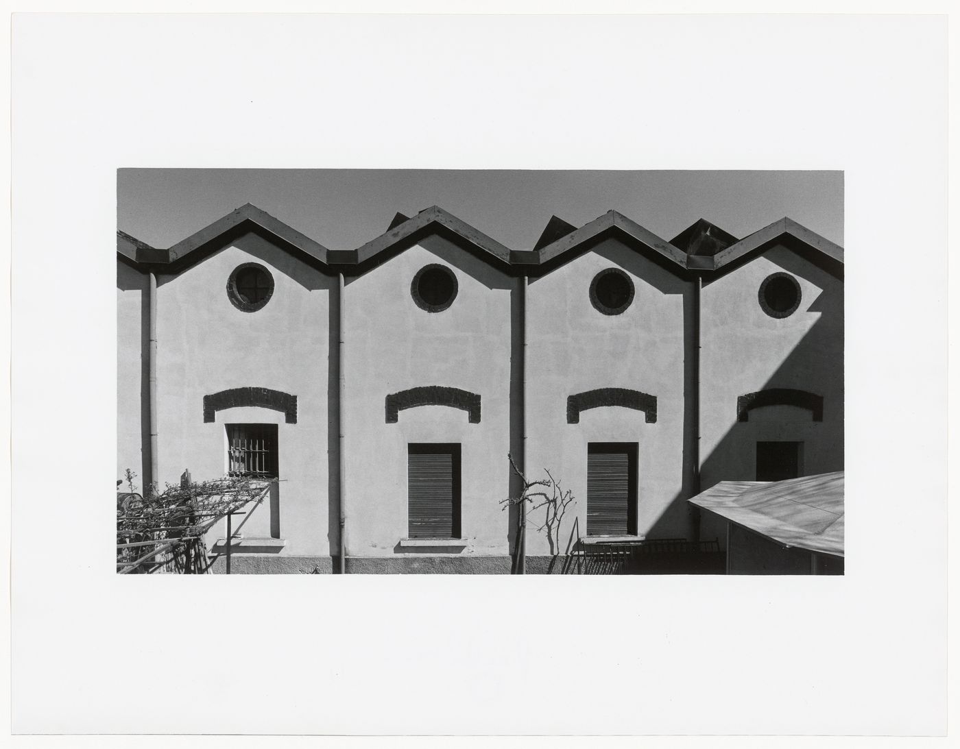 View of building with three windows and four circular windows, via Giuseppe Ripamonti, Milan, Italy