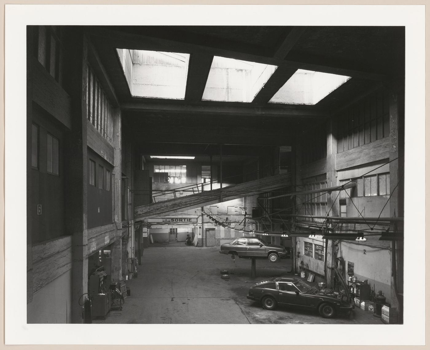 Interior view of Montée du Zouave garage (Motordrome) before renovation into Terrasse Saint-Denis, Montréal, Québec