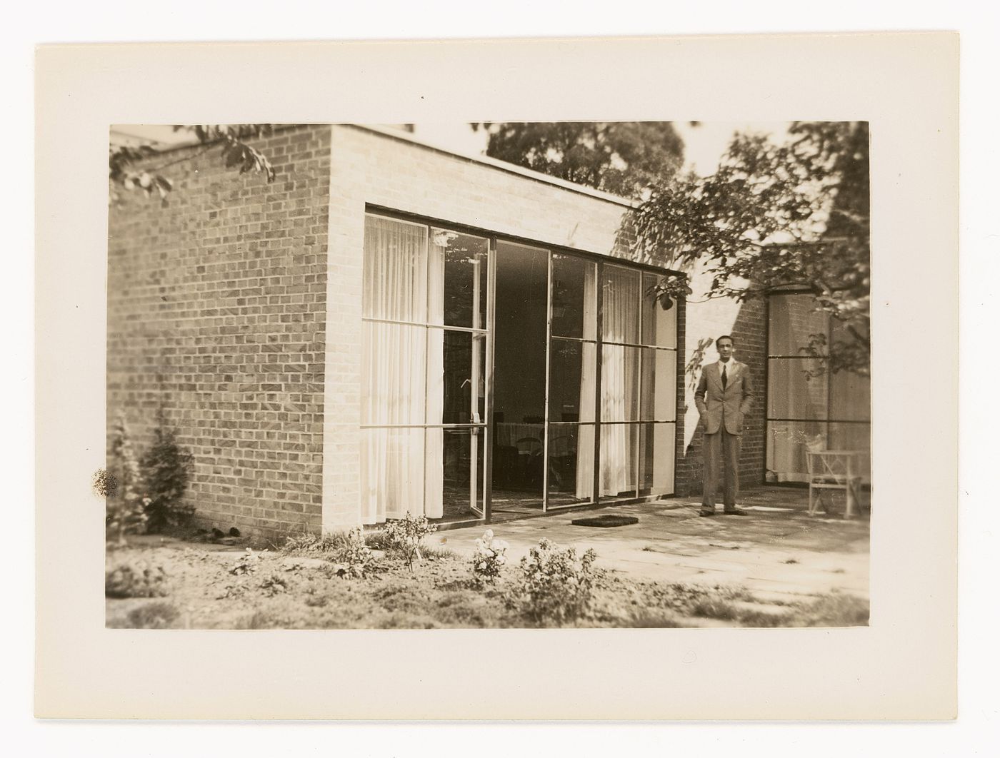 Man standing on the patio of the Karl Lemke House, Berlin