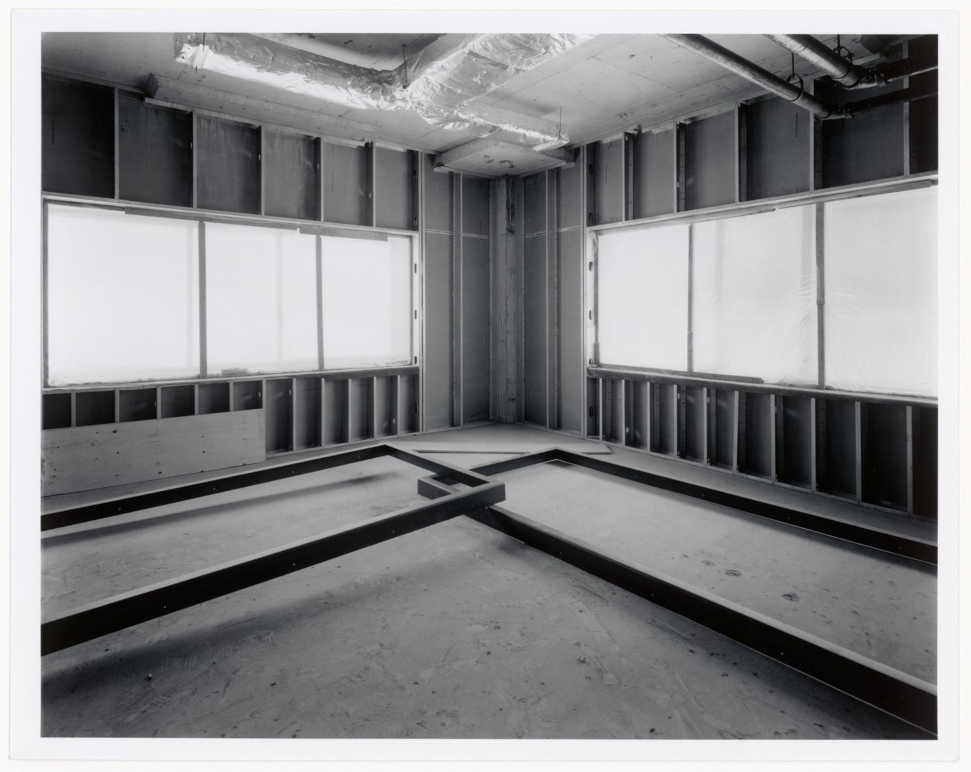Interior view of the northeastern corner of the curatorial level showing window frames prior to installation, Canadian Centre for Architecture under construction, Montréal, Québec