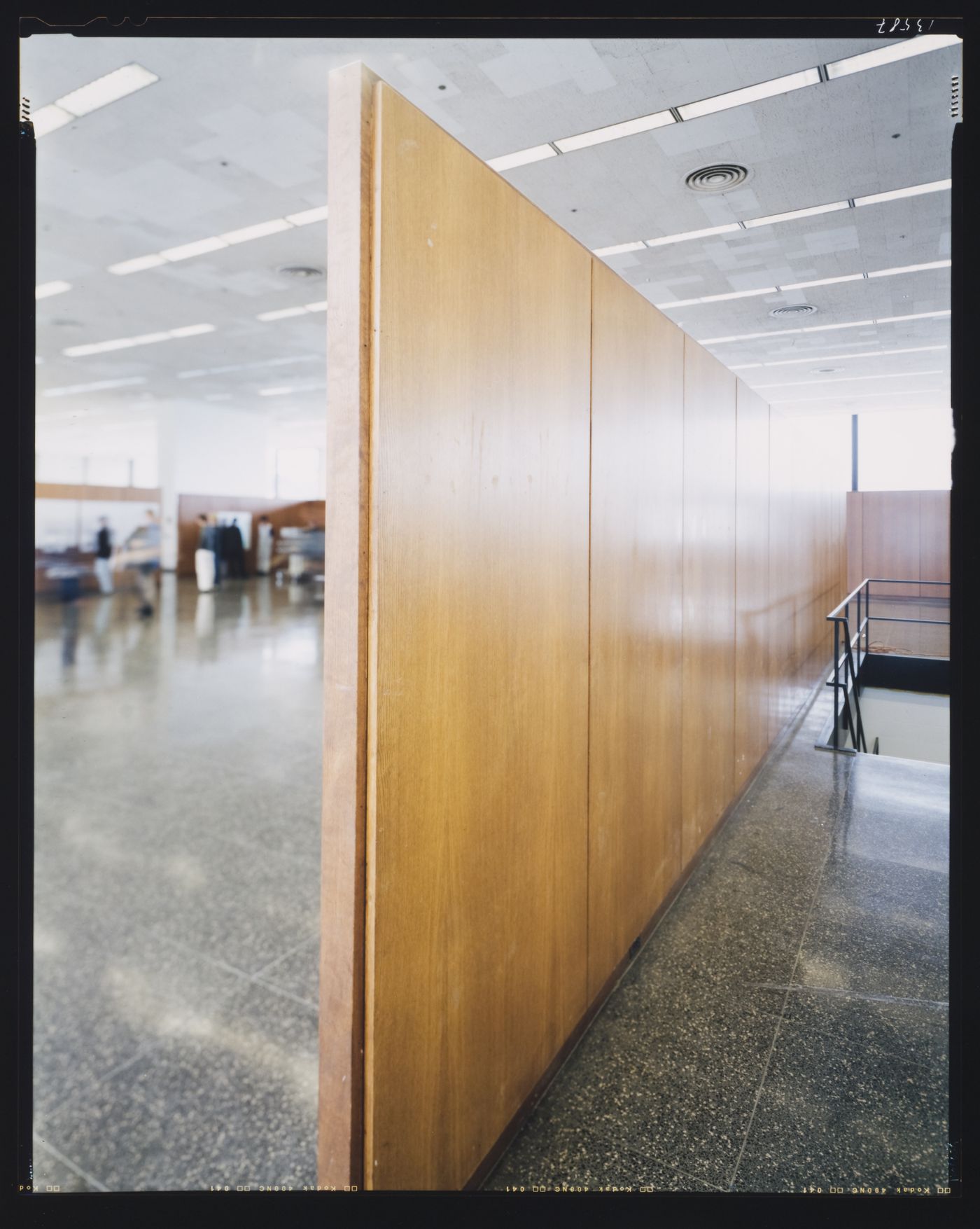 Interior view of Crown Hall showing a wooden wall and a stairwell, Illinois Institute of Technology, Chicago, Illinois