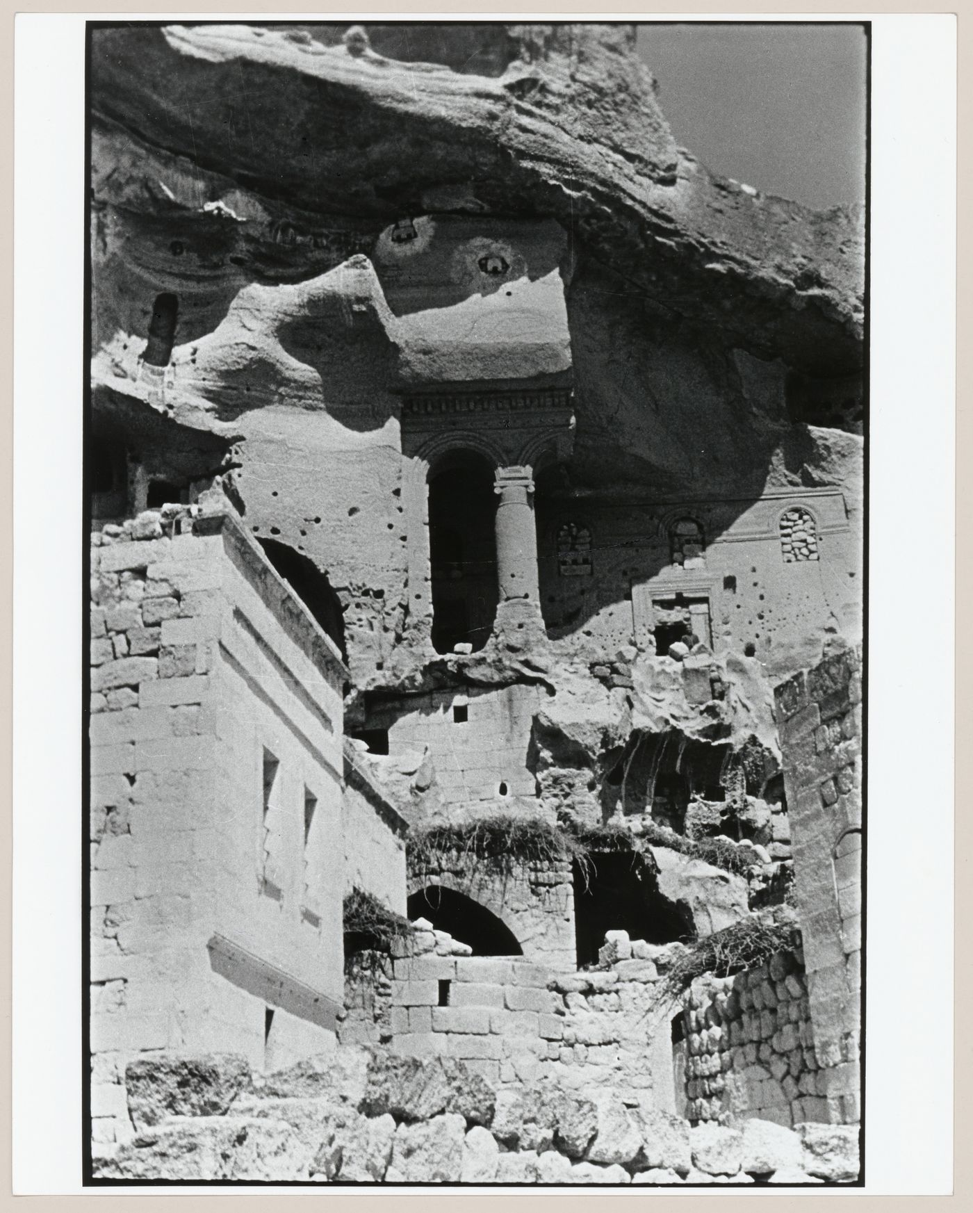 View of the ruins of the arcaded porch of St. John the Baptist Church from below, Cavusin, Cappadocia, Turkey