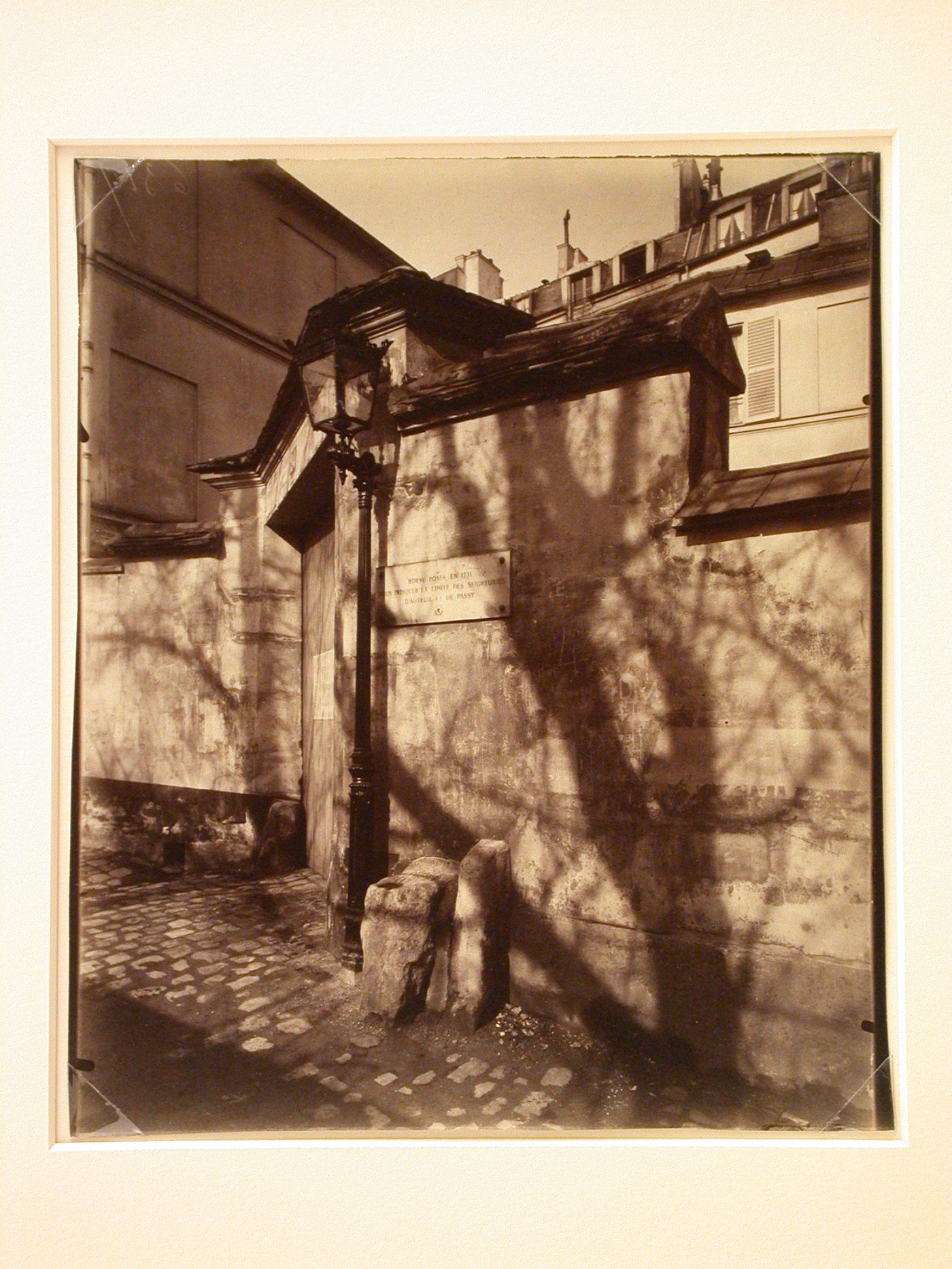 Maison de Balzac, showing front entrance in wall, street lamp and tree shadows, Paris, France