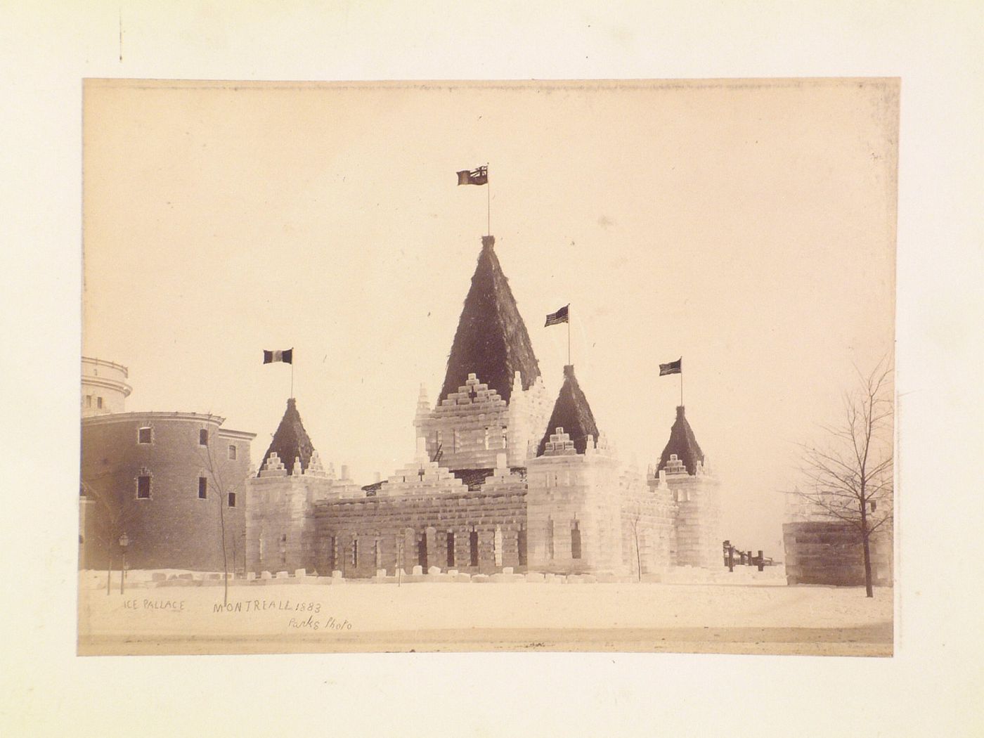 View of the Ice Palace of 1883 with the Cathédrale Saint-Jacques-le-Majeur (now the Cathédrale Marie-Reine-du-Monde) on the left, Dominion Square, Montréal, Québec