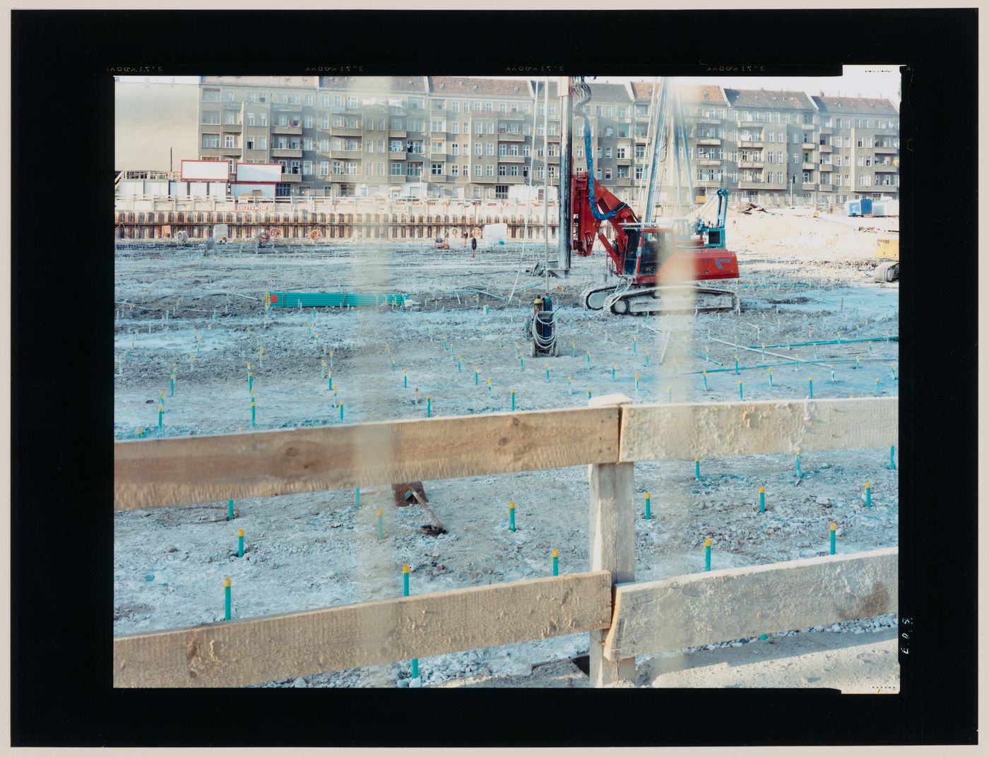 View of a building site and construction equipment showing apartment houses in the background, Berlin, Germany (from the series "In between cities")