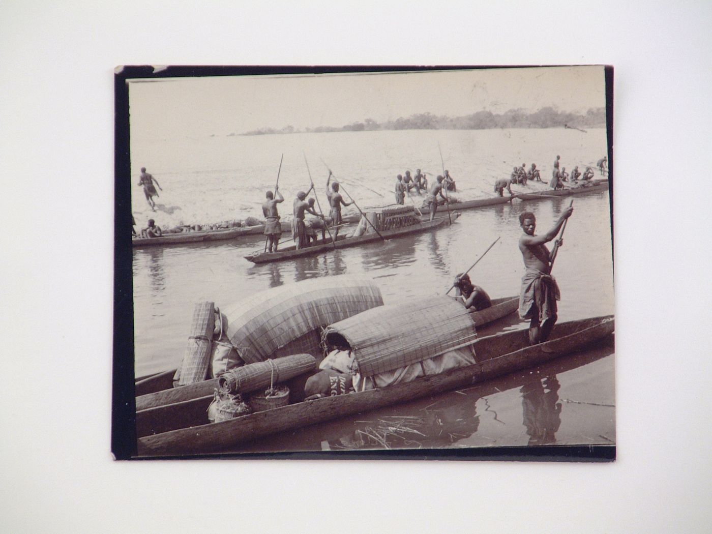 View of a group of people in mokoro (wooden dugout canoe) boats, Zambezi River