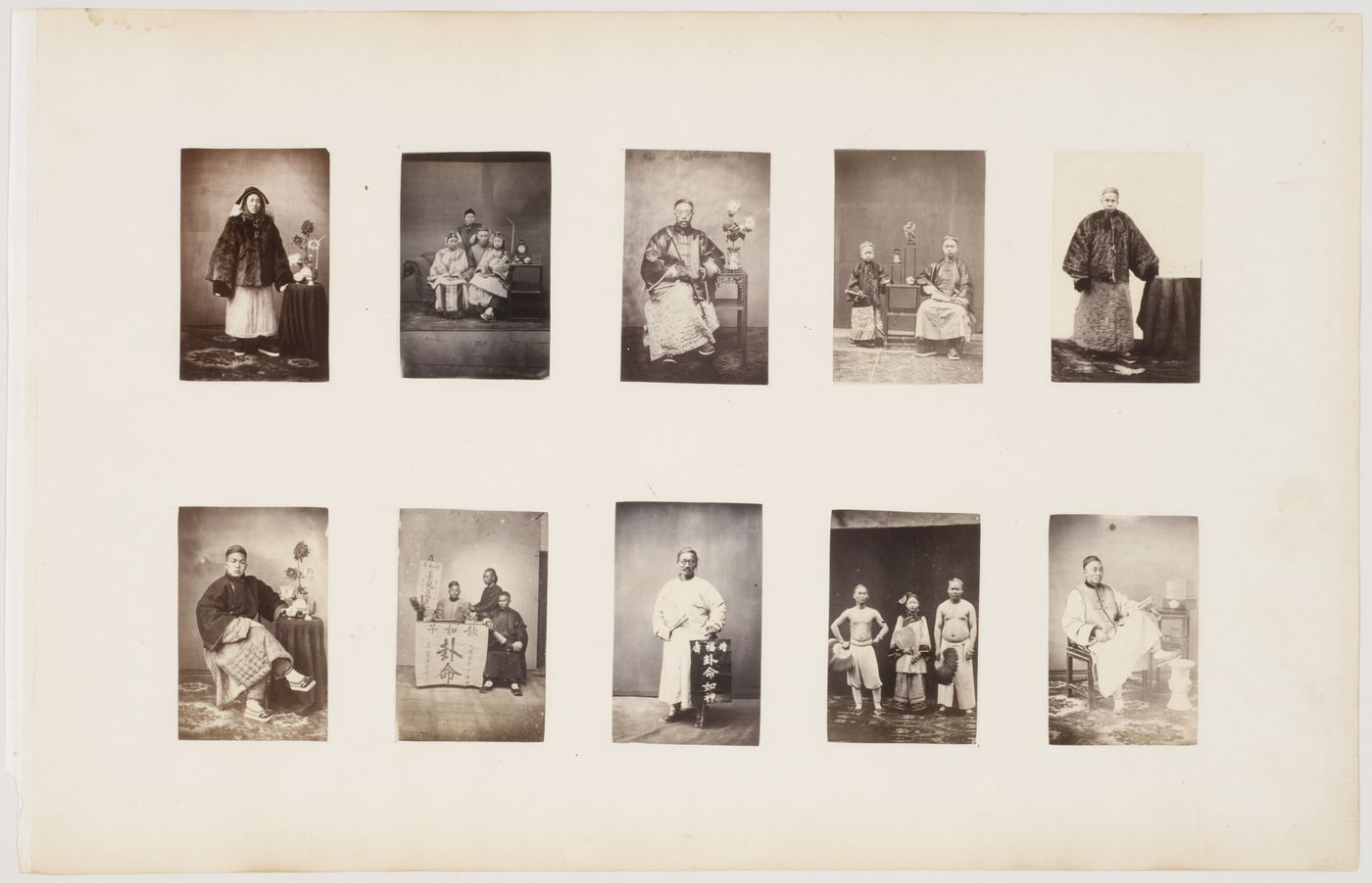 Portrait of a Chinese man seated beside a stand