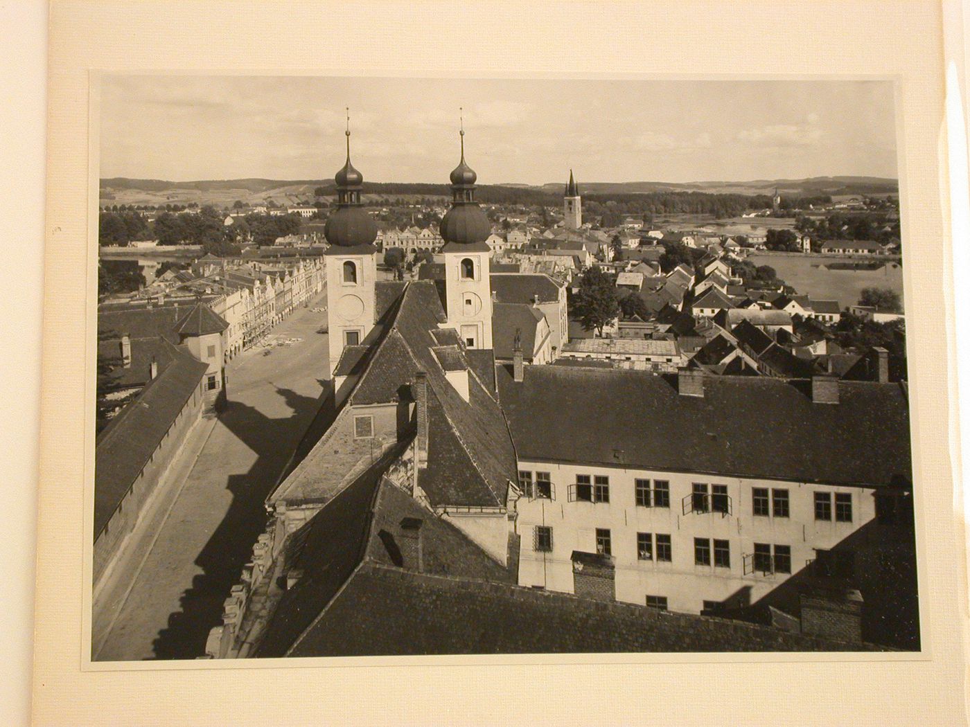 View from the tower of St. James Church and showing the Námestí Míru [Town Square] and the towers of the Church of Jesus' Name and the Church of the Holy Spirit, Telc, Czechoslovakia (now Czech Republic)