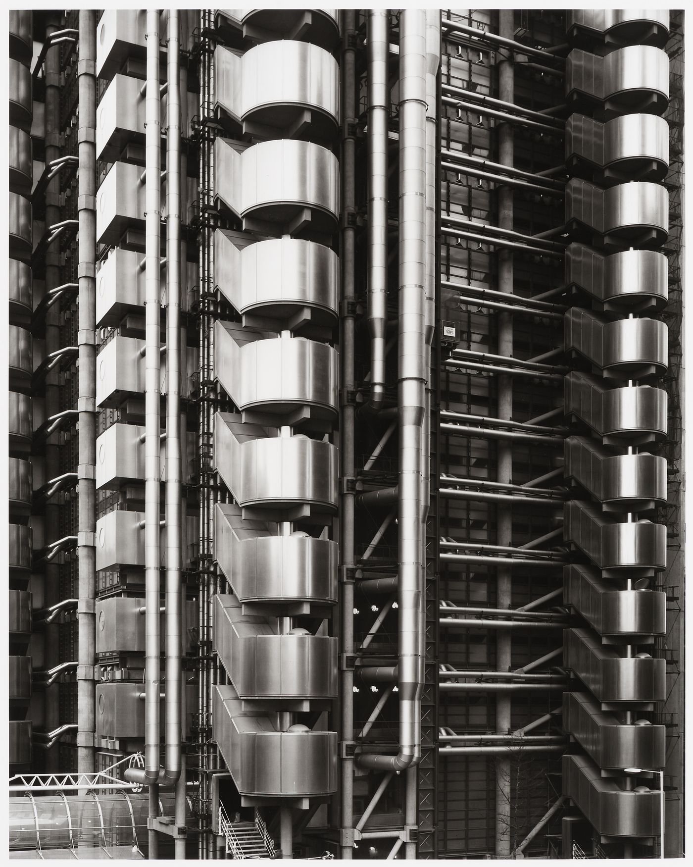 Partial view of Lloyd's Building from the north showing towers [?], stairwells [?], pipes, and conduits, London, England