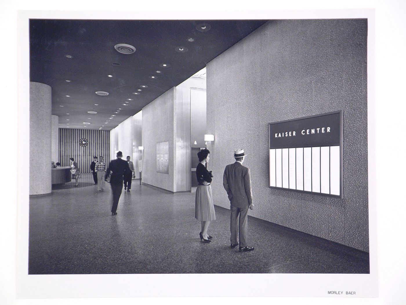 Interior view of the lobby of the Kaiser Center office building showing people, Oakland, California