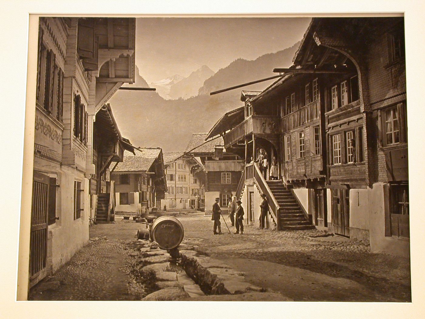 View of the town, with many wooden houses, and mountains, in the distance, Meirengen, Switzerland