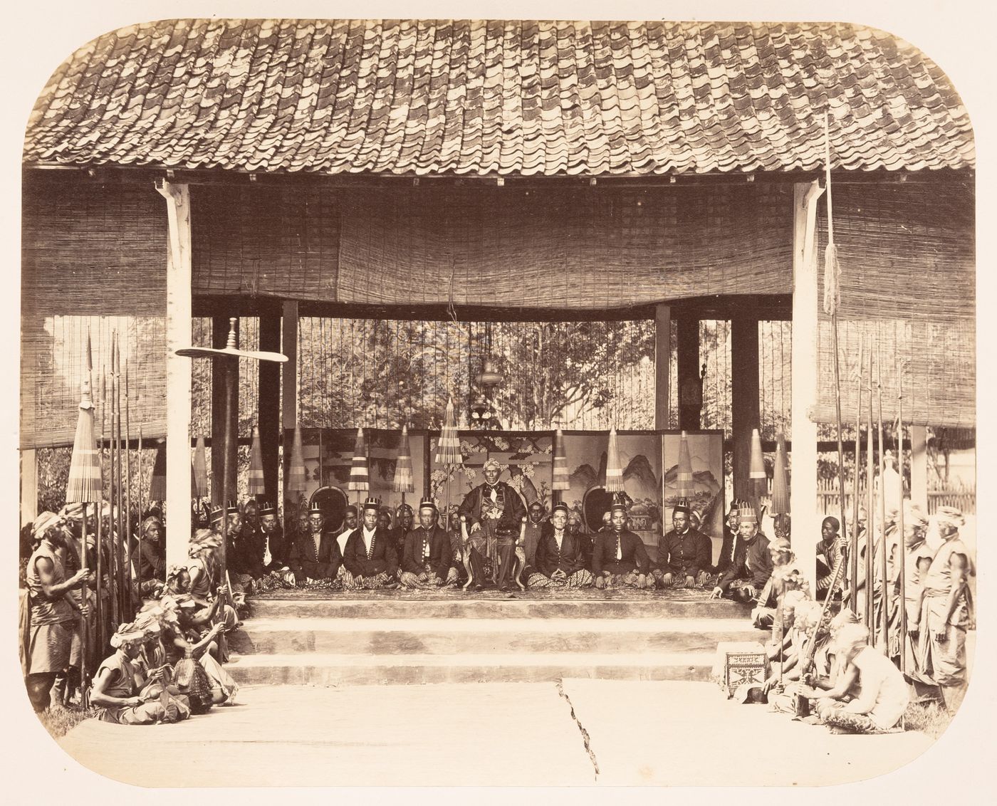 Group portrait of men in a building, probably in Solo (now also known as Surakarta), Dutch East Indies (now Indonesia)