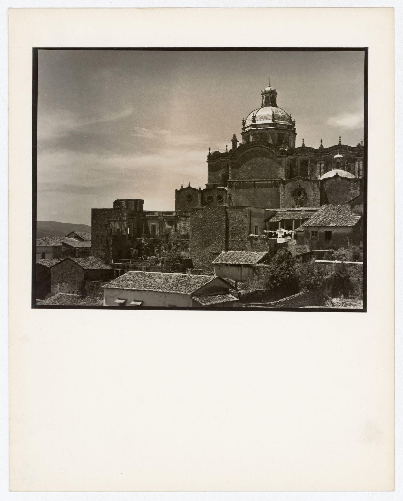 Partial view of Santa Prisca showing the dome with houses in the foreground, Taxco de Alarcón, Mexico