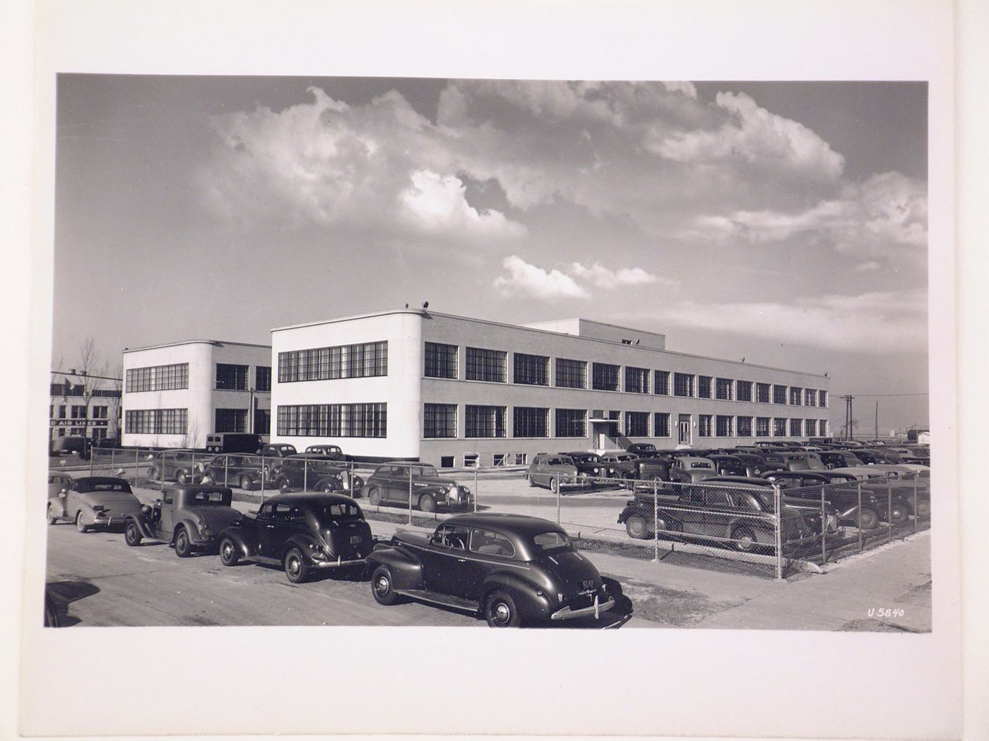 View of the principal and lateral façades of the Administration Building, United Aircraft Corporation Airplane Assembly Plant [?], Chicago, Illinois