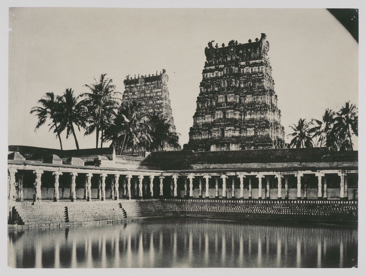 View of the Tank of Golden Lilies with the eastern gopuras in the background, Minakshi Sundaresvara Temple (also known as the Great Temple or Pagoda), Madura (now Madurai), India