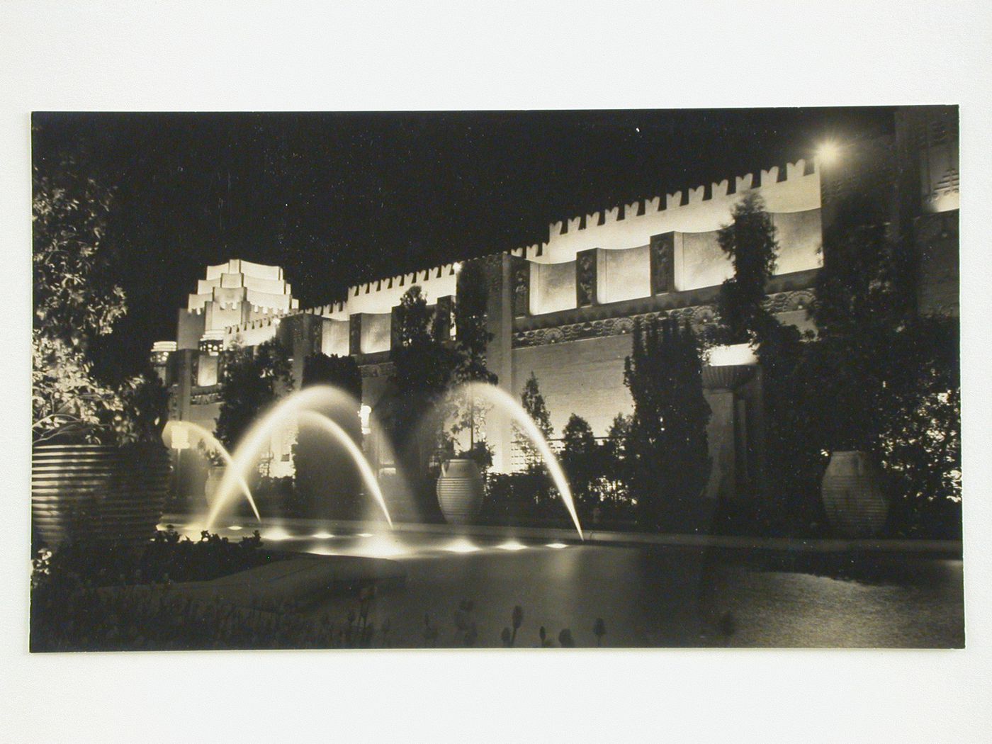 Night view of the fountain in the Court of the Moon and Stars with the Mines, Metals and Machinery Building in the background, Golden Gate International Exposition of 1939-1940, Treasure Island, San Francisco, California