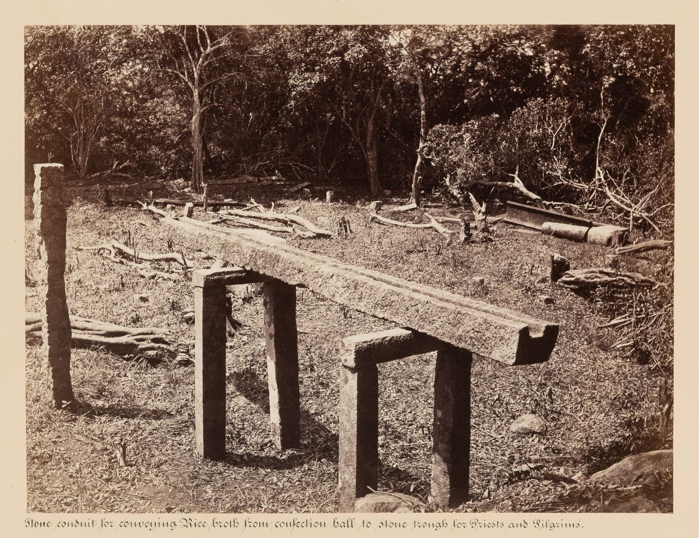 View of a stone conduit, near the Dana Salawa (also known as the Alms Hall and the Bhodana Salawa), Mihintale, Ceylon (now Sri Lanka)