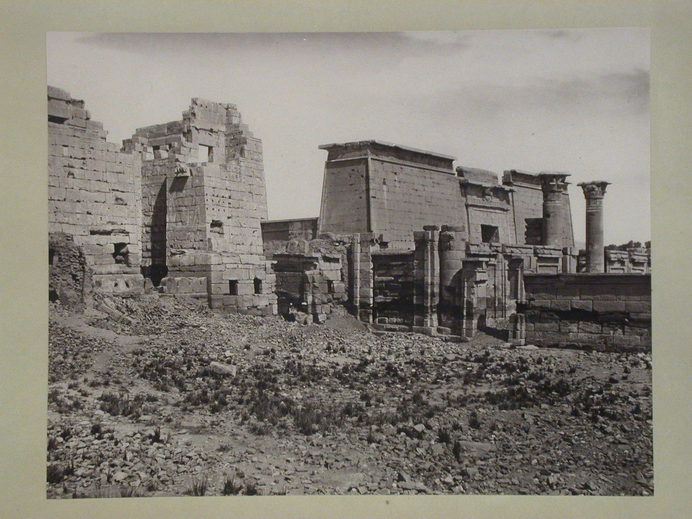 Egypt. Thebes. General view of the Temple of Medínmet Hâbu, eastern fortified gateway of Temple of Ramesses III, First Pylon of Small Temple (R).