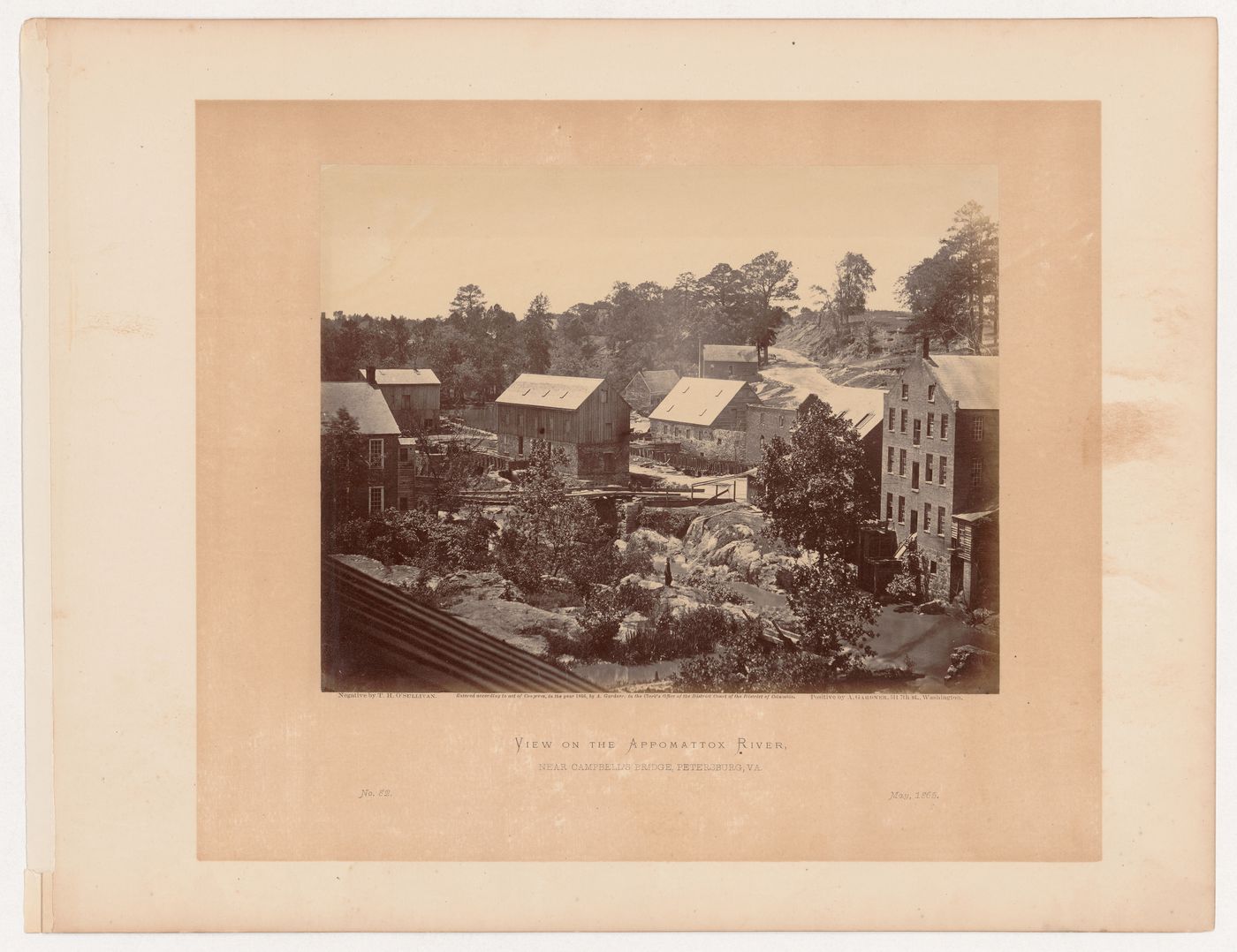 View of buildings along the Appomattox River, including the Merchant Manufacturing Company's cotton mill on the right, near Campbell's Bridge, Petersburg, Virginia, United States