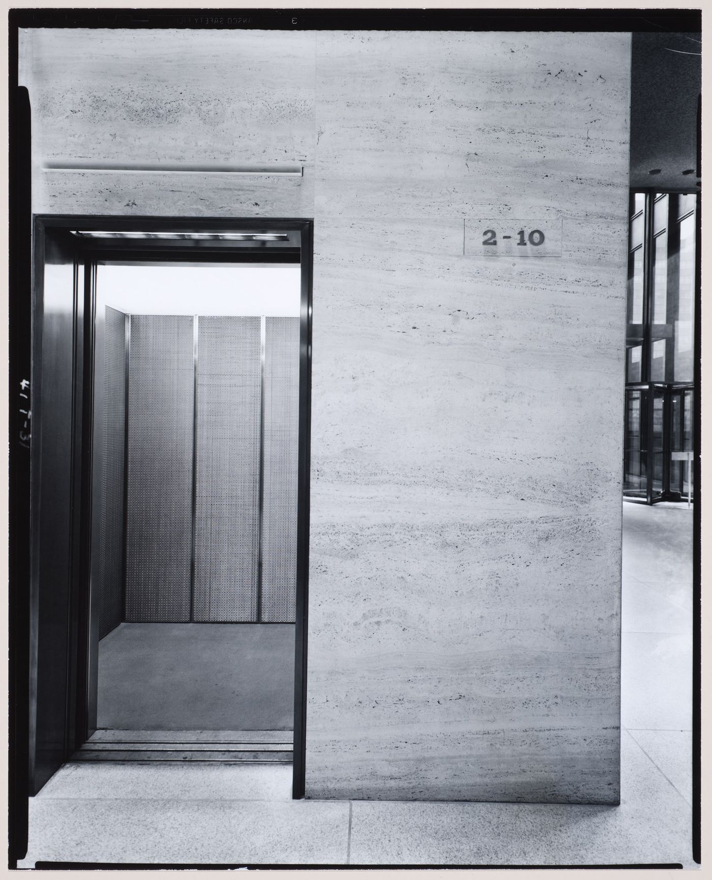 Interior view of the east lobby of the Seagram Building showing an elevator designed by Philip Johnson, New York City