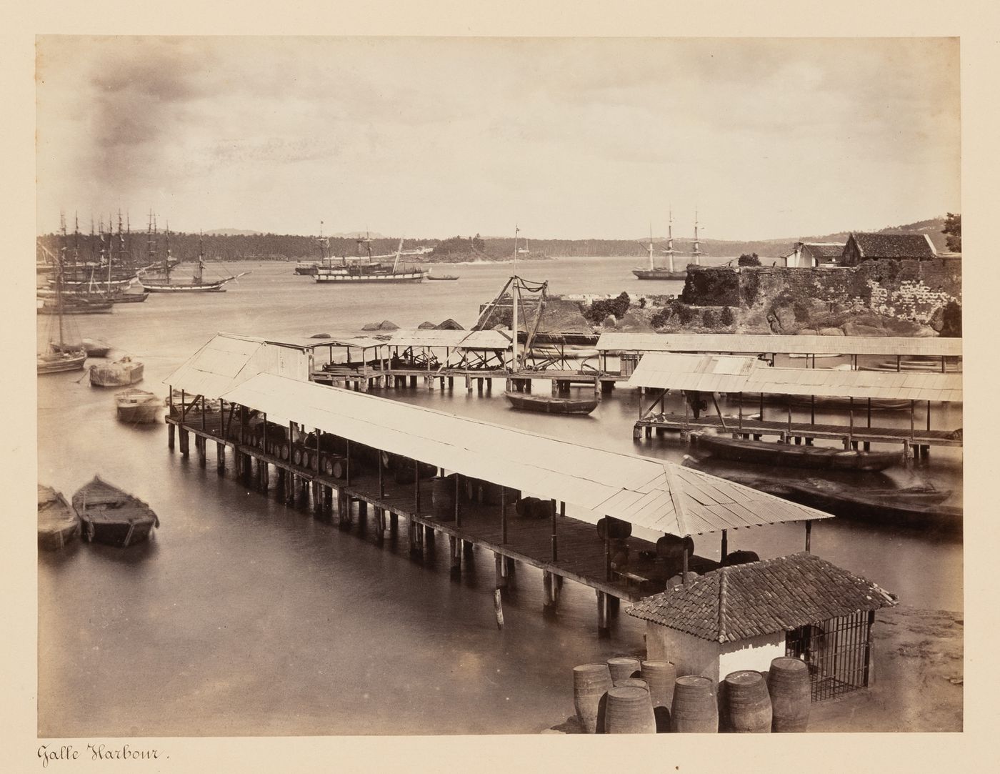 View of the harbour showing piers with ships in the background, Point de Galle (now Galle), Ceylon (now Sri Lanka)