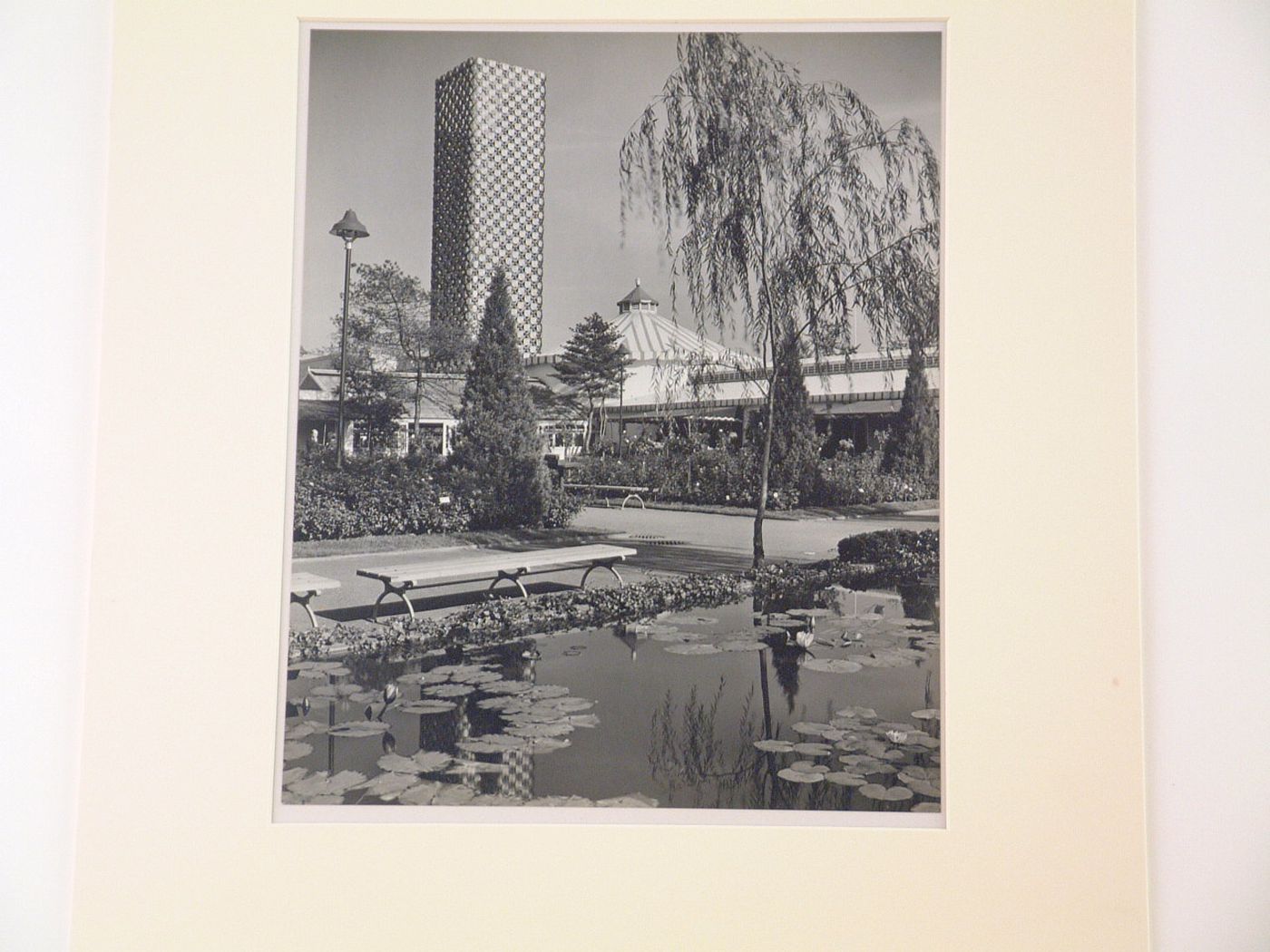 New York World's Fair (1939-1940): View of Polish Pavilion and Tower from a pond and garden foreground