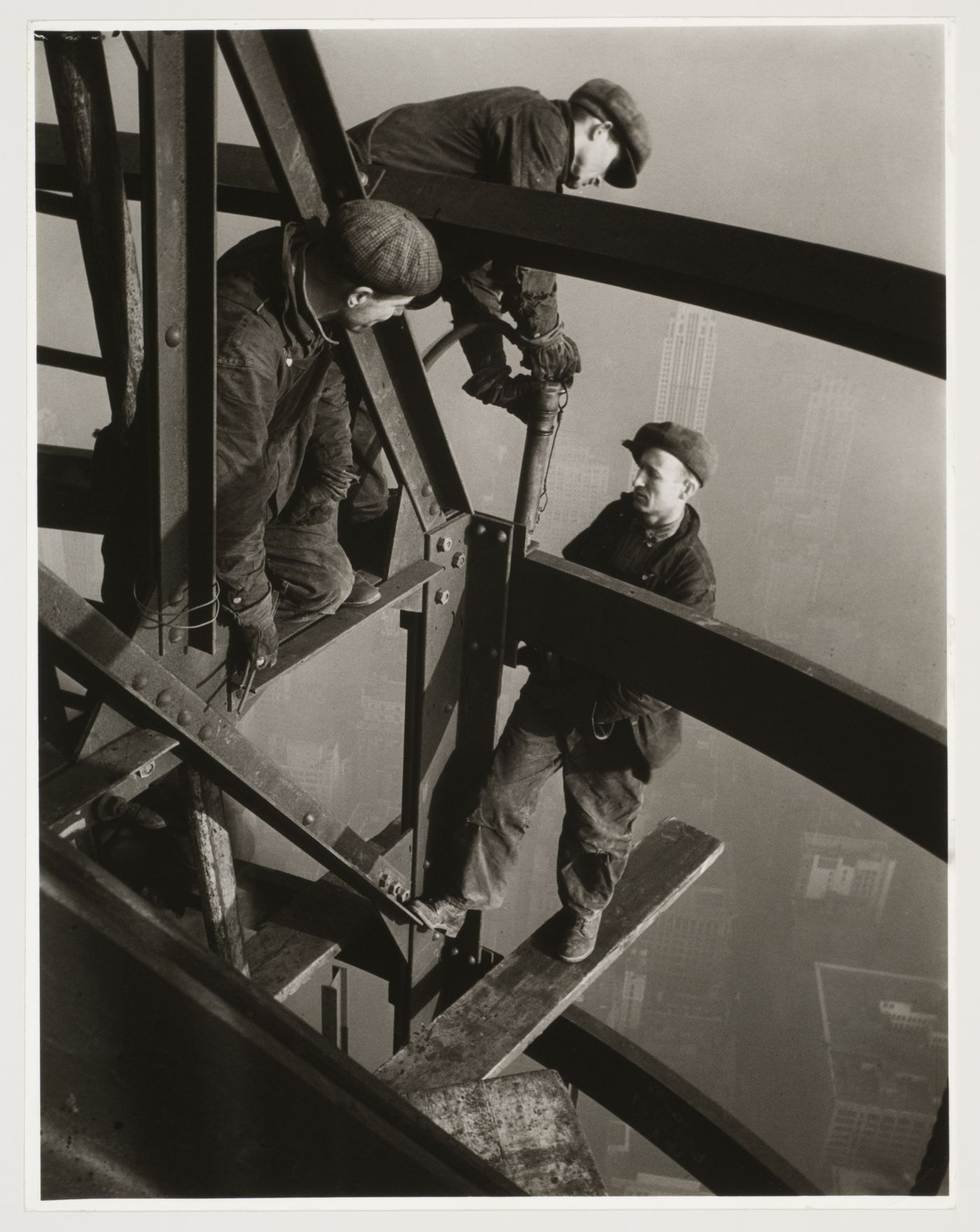 Riveters working on mooring mast, Empire State Building, New York City