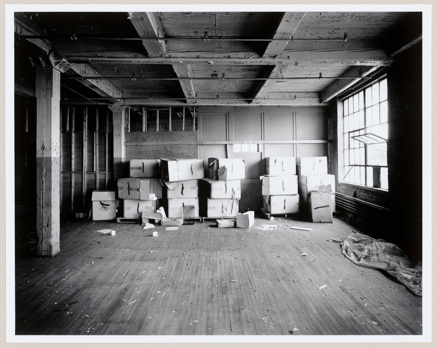 Interior view of the second floor of the Canadian Bag Company Building showing boxes stacked along a wall, Montréal, Québec