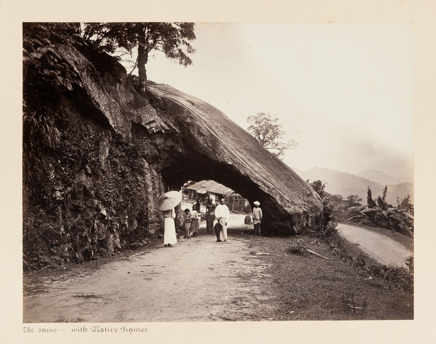 View of people, road and tunnel, Kadugannawa, Ceylon (now Sri Lanka)