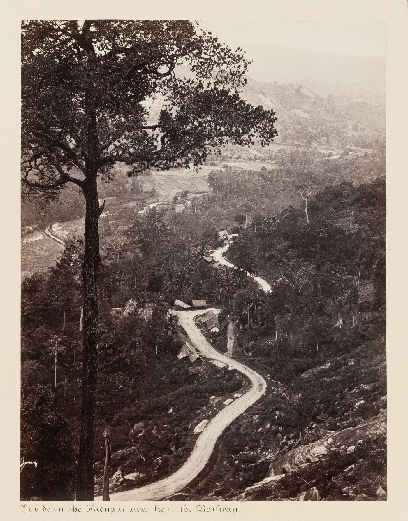 View of a valley and hills from the Colombo-Kandy Railway, near Kadugannawa, Ceylon (now Sri Lanka)
