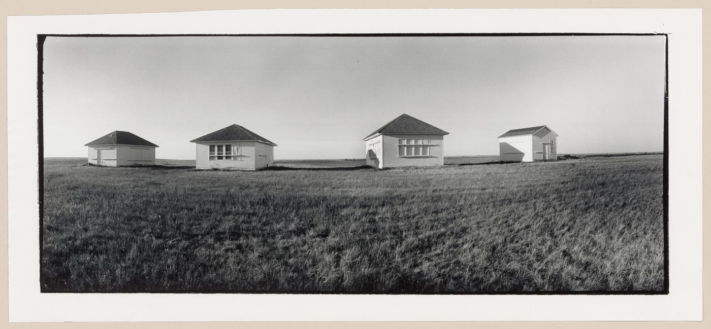 Panoramic view of four small houses on a prairie, North Dakota, United States