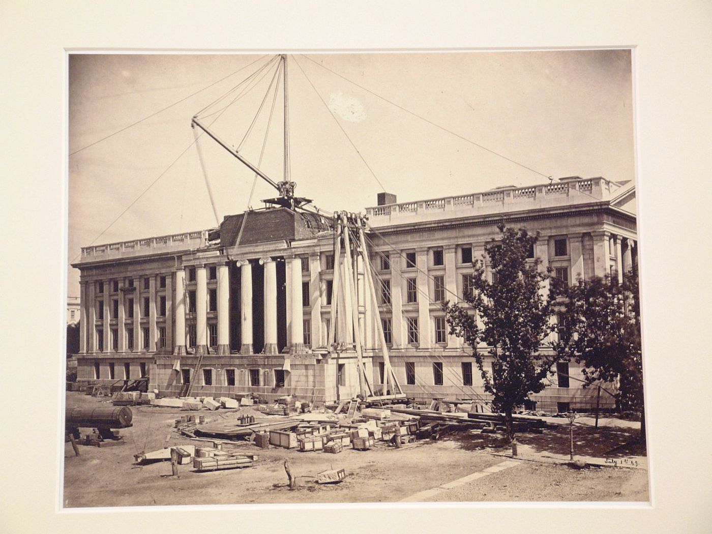 Treasury Building under contruction: Crane of supports and lines tied up to roof, Washington, District of Columbia