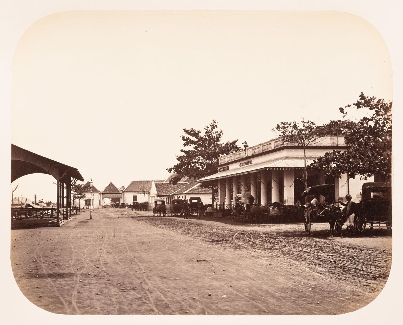 View of the Stads Herberg [City Inn], the Kleine Boom [Small Custom Post], a street and carriages, Batavia (now Jakarta), Dutch East Indies (now Indonesia)