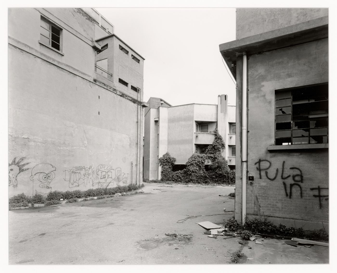 View of an alley and buildings with graffiti, Malteria Adriatica, Marghera, Italy