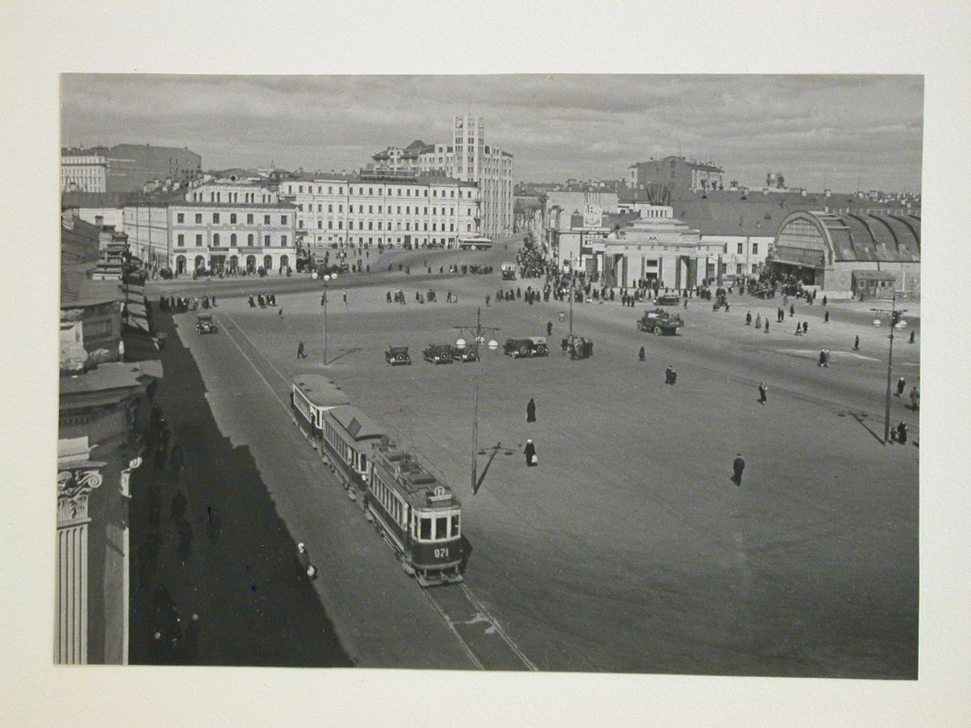 View of Arbat Square with street car, cars, and people, Moscow