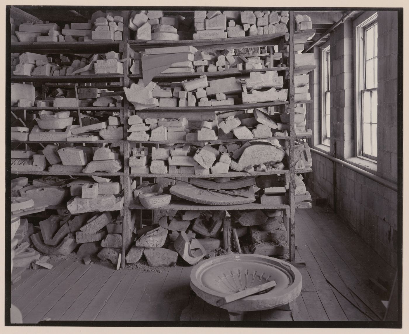 View of shelves of terra-cotta molds in terra-cotta factory, Lincoln, California