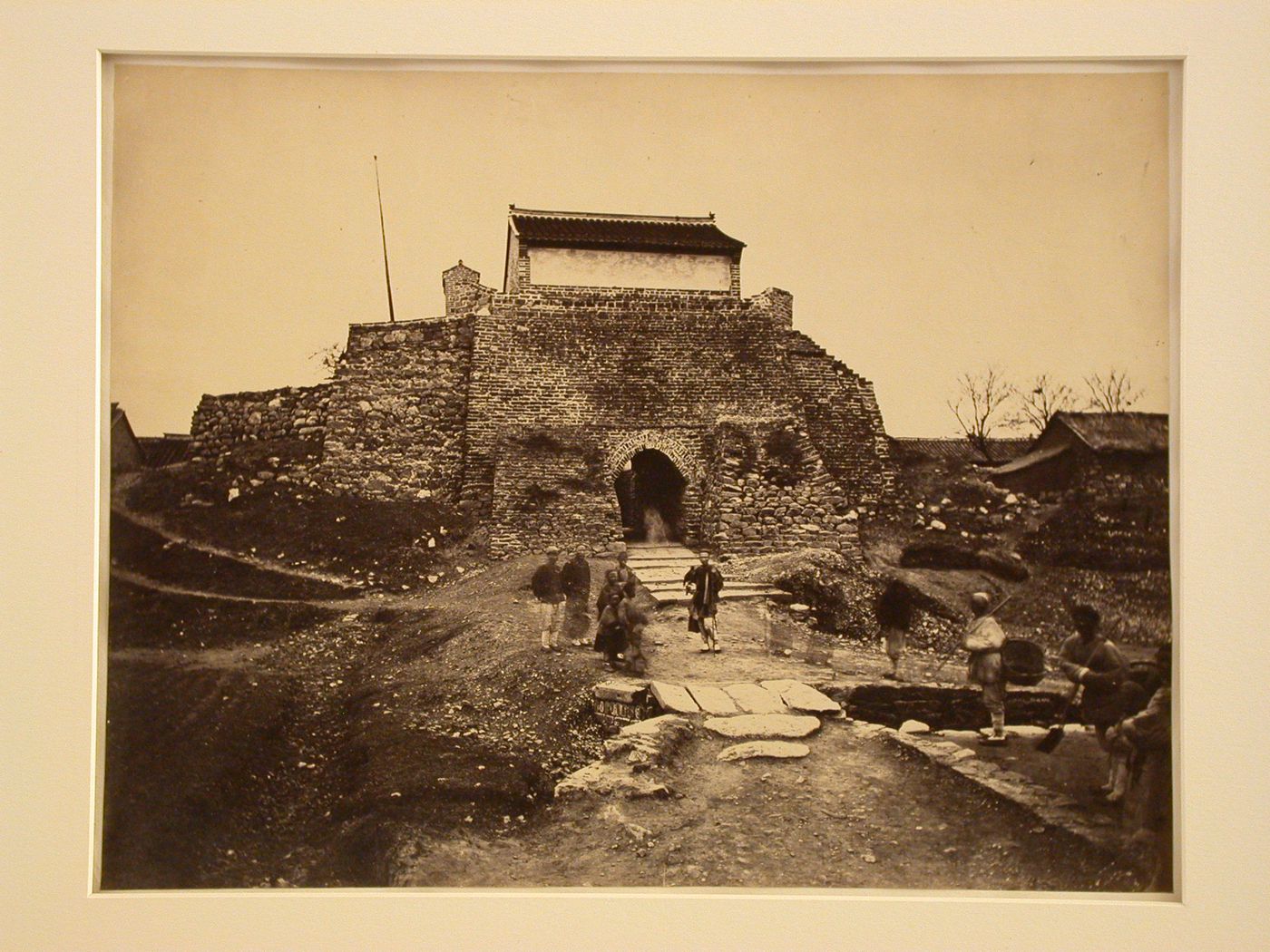 View of a brick gateway and several people, Yent'ai (also formerly known as Chefoo, now Yantai), China